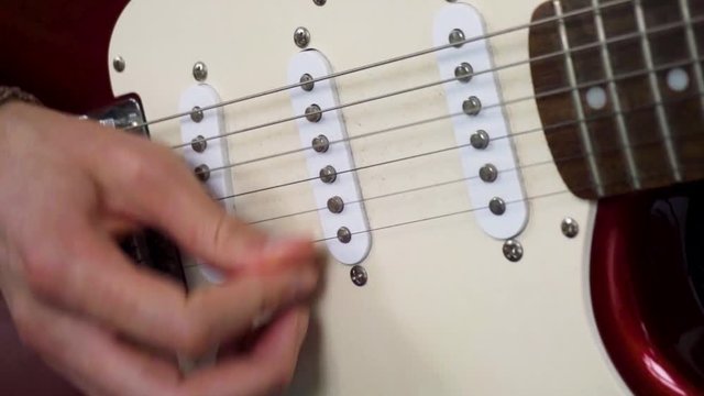Funky strumming on electric stratocaster guitar