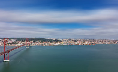 Fototapeta na wymiar 25 de Abril Bridge and Lisbon ultra long exposure