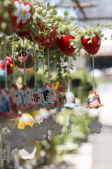 Hanging plant pots with green plants.