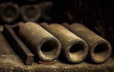 Old Wine Bottles Laying in Racks in Cellar