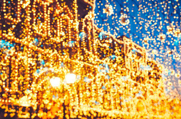Bright Christmas Street Illumination on the facade of the buildings. The City is Decorated for the...