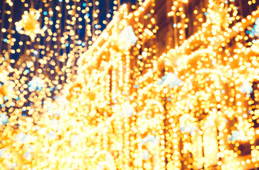 Bright Christmas Street Illumination on the facade of the buildings. The City is Decorated for the...