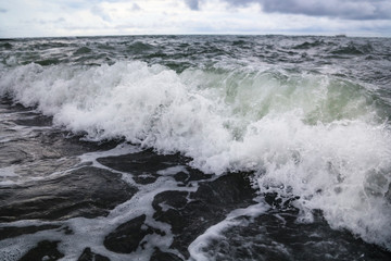 Storm waves on the seashore as a background