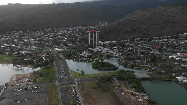 Sunset on the coast of Honolulu in Hawaii. Boats, Jets Skis, and Cars