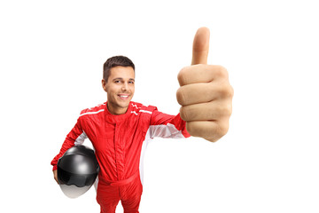 Racer holding a helmet and showing thmbs up © Ljupco Smokovski