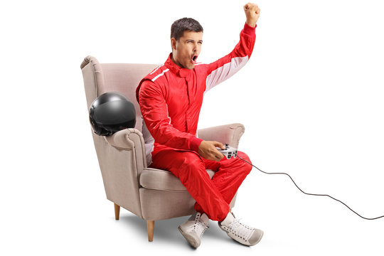 Racer sitting in an armchair, playing video games and gesturing with hand