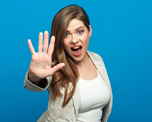 Woman showing stop symbol with outstratched hand