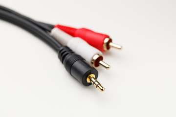 RCA mini jack audio cable, white background