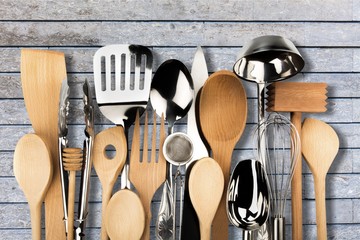 Kitchen metal and wooden utensil on  background