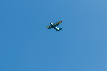 Biplane flying in blue sky