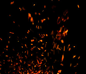flame of fire with sparks black background