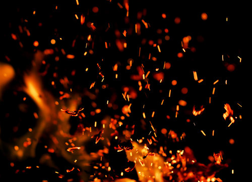 flame of fire with sparks black background