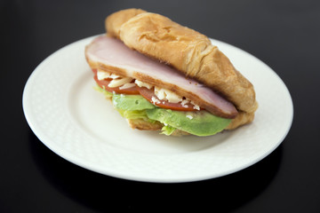 crossiant sandwich avocado, bacon, cheese, lettuce