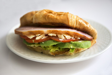 crossiant sandwich avocado, bacon, cheese, lettuce