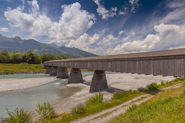 Old wooden bridge crossing the Rhine between Liechtenstein and Switzerland, Europe.