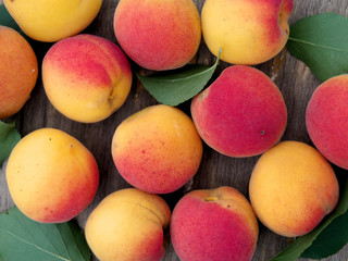 ripe apricots on a wooden table viewed from above close-up. organic, healthy and fresh fruit. horizontal top view