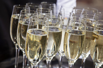 Full champagne Glasses at a party