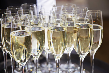 Full champagne Glasses at a party