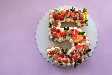 birthday cake in the shape of the number five