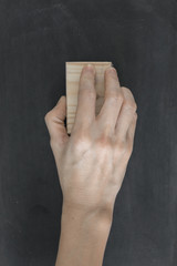 Hand hold brush remove on blackboard