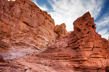 Fototapeta na wymiar Travel in Israel, tourist destination in the Eilat Mountains: Red Canyon, giant cliffs