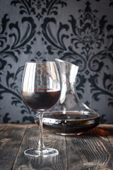 Decanter and glass with red wine