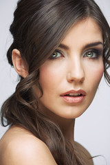 Close up face portrait in beauty style of young woman with curly