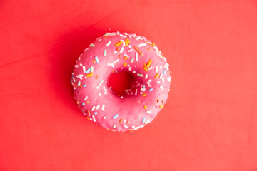 pink donut in colorful background