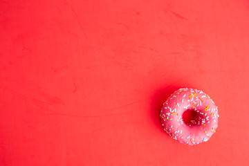 pink donut in colorful background