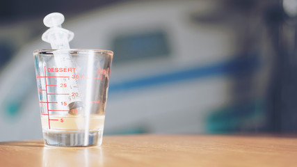 syringe in the glass in sunlight