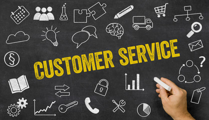 Customer service written on a blackboard with icons