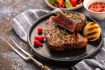 Steak - grilled beef steak. Fillet steak beef meat with  fresh salad, cherry tomatoes  and red pepper