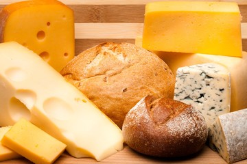 Cheese and Rolls on the Wooden Platter - Close Up