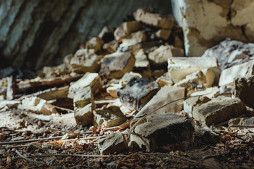 abandoned building with scattered damaged bricks on floor