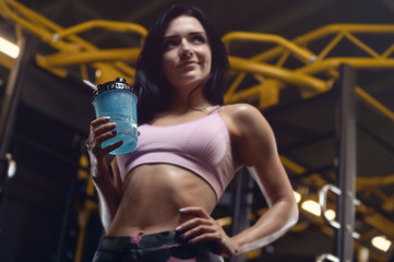 Beautiful sexy athletic young girl working out in gym