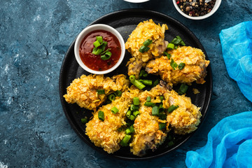 Chicken wings in breading. Deep fried chicken wing. American food
