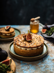 Tarte on sand base with fresh figs, almonds and crispy waffle with almonds and cocoa powder. Fresh Homemade Fruit Tart with berries
