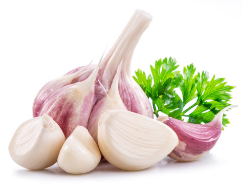 Garlic bulb, garlic cloves and parsley.