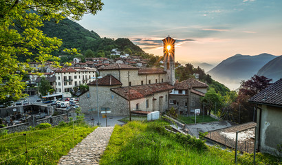 Obraz premium Village of Brè. Switzerland, May 12, 2018. Beautiful view of sunrise from Monte Brè Mountain.