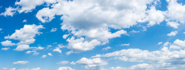 White fluffy clouds on a blue sky