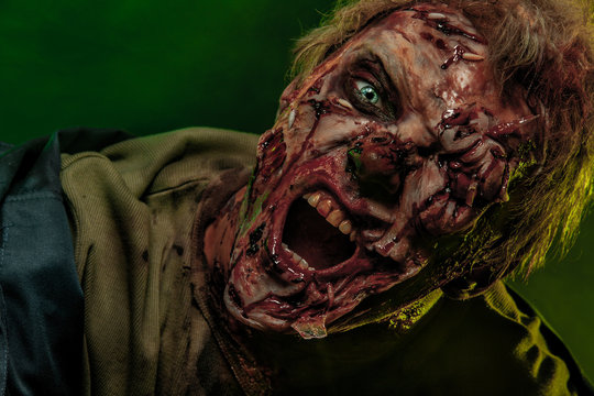 Close-up portrait of a horrible scary zombie man. Horror. Halloween 2018