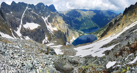 Morskie Oko. High Tatras, Poland, May 27, 2018. Beautiful landscape of snowy mountain tops and the lake between them. © volff