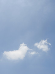 Broad blue sky with beautiful soft white clouds in sunny weather. Outdoor nature landscape background concept.