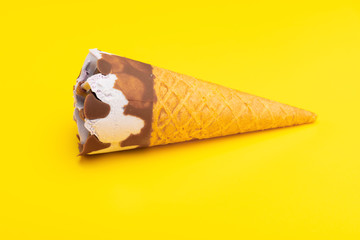 mini Vanilla flavor ice cream cone on yellow background