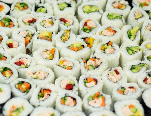 sushi rolls on the plate isolated on white