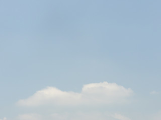 Broad blue sky with beautiful soft white clouds in sunny weather. Outdoor nature landscape background concept.