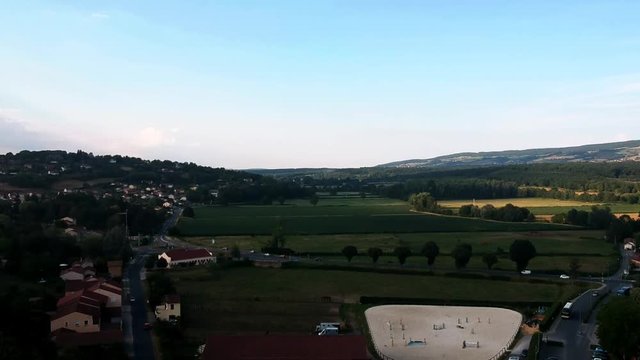 Dron aerial shot of Hills and road in small-town France, Cluny.