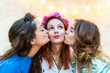 Women kissing a happy girl on her birthday