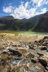 Standing in the center of a wild mountain creek, flowing in rivulets into the Nassfeldspeicher...