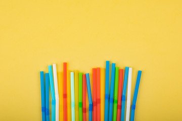 Drinking straws for colored background. Colorful plastic straws used for drinking water or soft drinks.